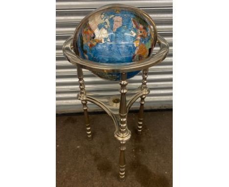 A large gemstone floor standing rotating globe with compass inset measures approx 38 inches tall 