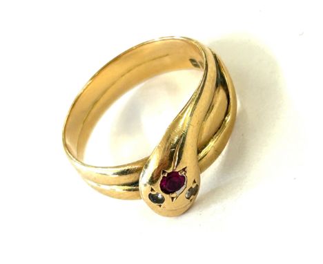 18ct gold snake ring set with diamond eyes and ruby head, hallmarks Sheffield 1926. Weighs approx 4 grams. Uk ring size L 