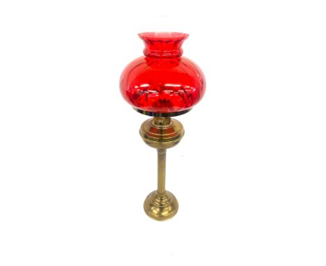 Vintage cranberry and brass oil lamp measures approx 28 inches tall 