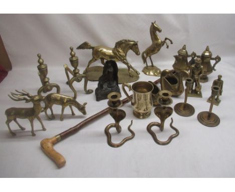 Two large brass horses, two fire dogs, metal musical statue for Lourdes, walking stick, etc 