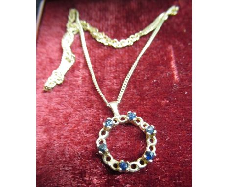 C20th hallmarked 9ct gold pierced circular pendant with six claw set sapphires on a 9ct gold link chain necklace with spring 