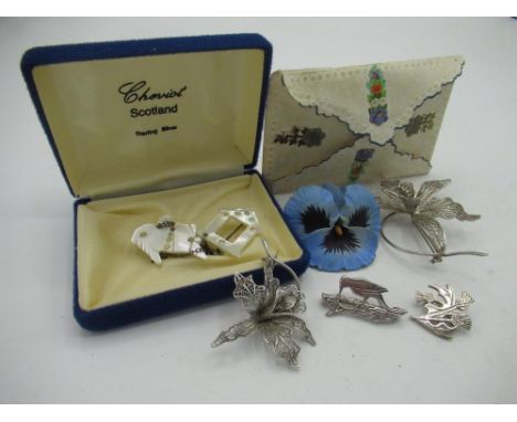Large white metal brooch in the form of a filigree daffodil W5.5cm and another smaller both stamped 800, two small silver bro