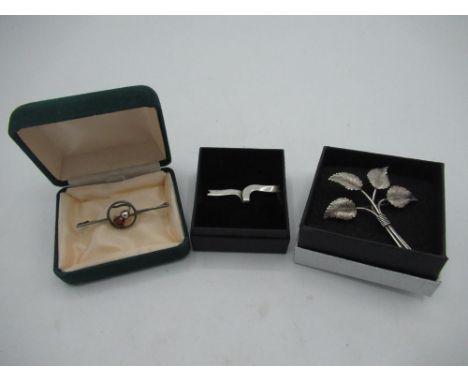 Silver bar brooch with an amber coloured thistle centered in a circular mount, stamped C.H, Charles Horner style silver leaf 