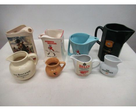 Eighteen branded ceramic whisky advertising water jugs, Famous Grouse, Glenlivet, Johnnie Walker etc 