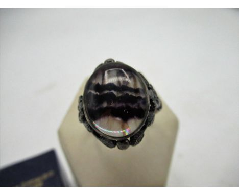 Blue John ring with oval central set Blue John with rub over setting, shank stamped Silver, size S in original box 