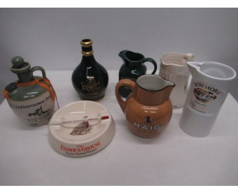 Eighteen branded ceramic whisky advertising water jugs and a ashtray, Tullamore Dew, Bowmore, Johnnie Walker black label, Gle