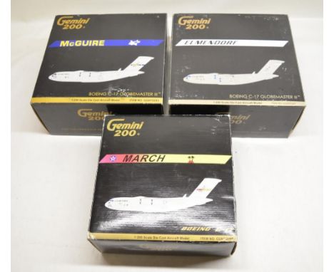 Three Gemini Jets 1/200 Boeing C-17 Globemaster 111 die cast models. The Elmendorf model has some light damage but parts pres
