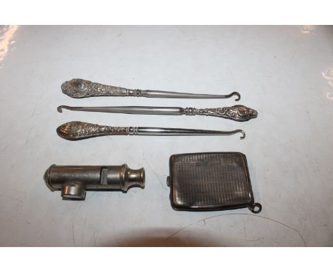 A silver matchbook cover AF; three silver handled button hooks; an EMCA whistle mounted with a compass 