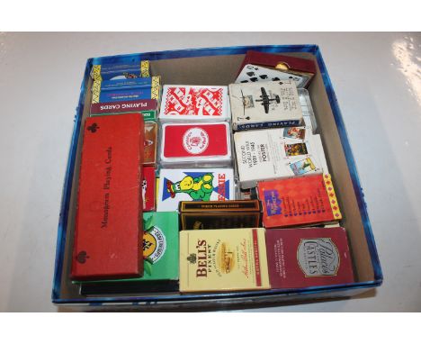 A box containing approx. 30 playing card packs and markers