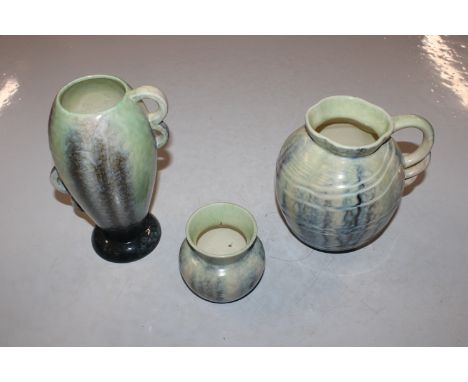 A Sylvac pottery jug and two vases decorated with running glaze