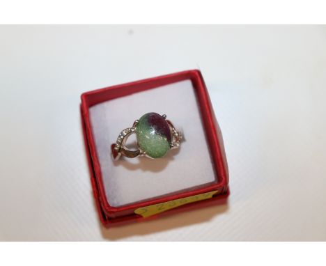 A sterling silver diamond and natural ruby dress ring, ring size P/Q, approx. 5.5gms