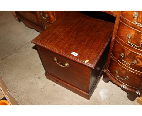 A 19th Century mahogany commode with brass carrying handles