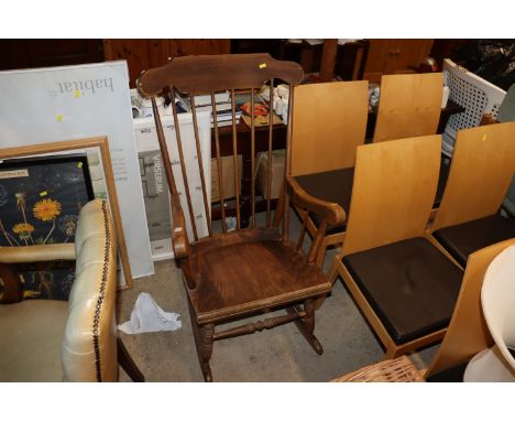 An elm stick back rocking chair