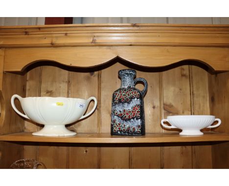 A white glazed pottery twin handled vase; a smaller similar and a West German pottery flask