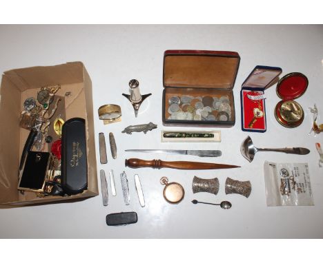 A box of interesting items to include a leather box of coinage; a Georg Jensen stainless steel ladle; a Ronson table lighter;