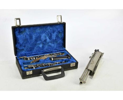 BOOSEY &amp; HAWKES; a cased 'Emperor' oboe, with music stand (2).Condition Report: With reed please see additional image.