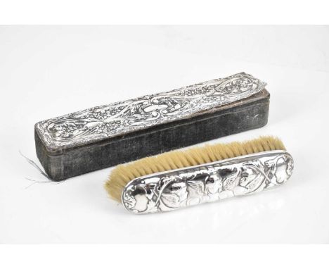 WILLIAM COMYNS &amp; SONS; a Victorian hallmarked silver hairbrush, with embossed cherub decoration, London 1900, and a hallm