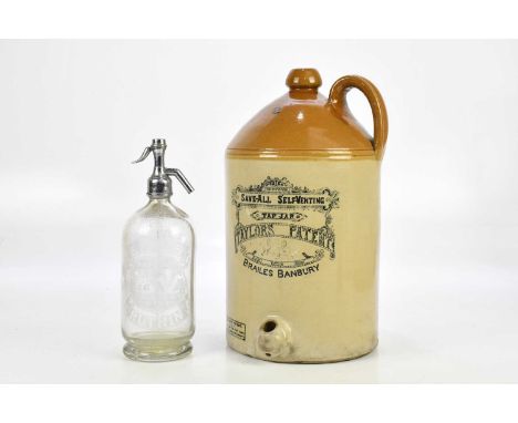 A Taylors Patent Save-All Self-Venting tap jar, Brailes, Banbury, height 41cm, with an advertising clear glass soda syphon fo