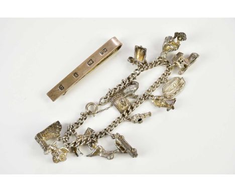 A silver charm bracelet and a silver tie slide, combined approx 61g (2).