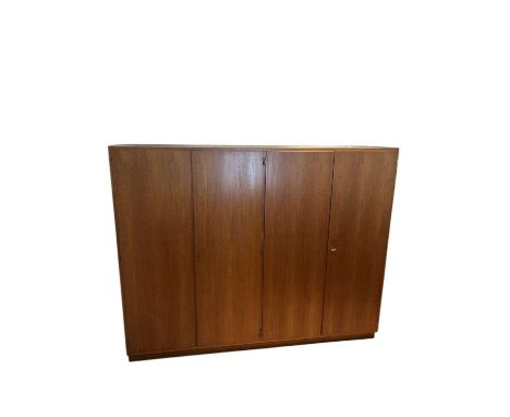 A mid century Danish teak four door wardrobe.