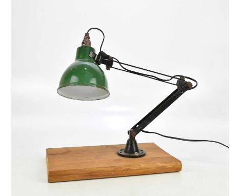 A British made Anglepoise type desk light, with green enamel shade, mounted on pine plinth.