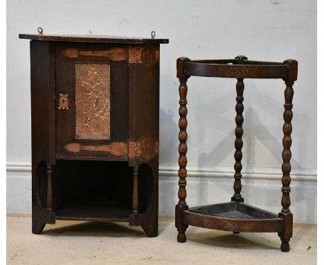 An Arts and Crafts copper mounted oak hanging corner cupboard, height 78cm, width 52cm, and a 1920s demi-lune stick stand (2)