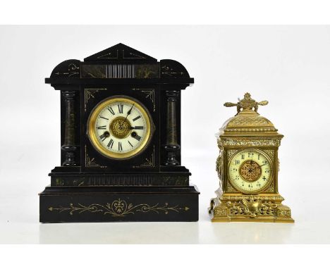 A late 19th century French brass mantel clock, with urn finial and cast decoration above the dial set with Arabic numerals, h
