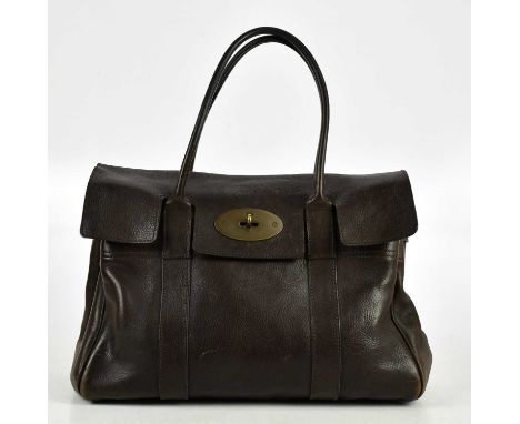 MULBERRY; a deep mahogany brown grained leather classic Bayswater handbag, with two top handles, brass tone front postman’s l