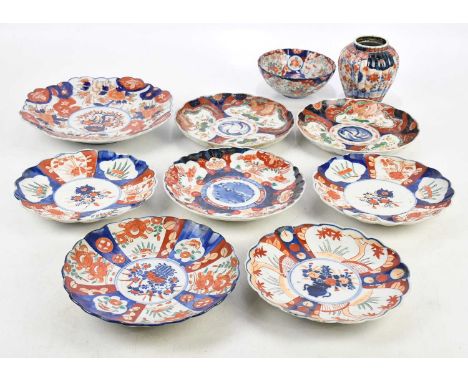 A collection of late 20th century Imari pattern plates, with charger, diameter 28cm, bowl, and vase, height of vase 13cm.