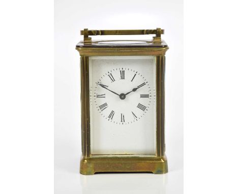 A late 19th century French brass carriage clock, the enamel dial set with Roman numerals, height 11cm, fitted in travelling c
