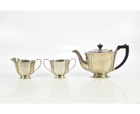 S BLANCKENSEE &amp; SON LTD; a George V hallmarked silver three piece tea service with panel decoration, Birmingham 1935, app