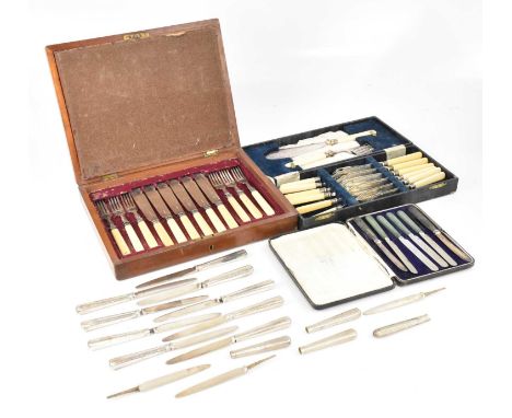 A collection of silver handled/bladed and white metal table knives and a collection of silver plated flatware, including fish