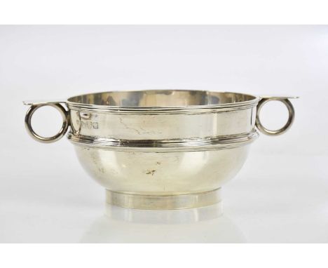 BARKER BROTHERS; a George V hallmarked silver twin handled bowl, Chester 1923, approx 7.52ozt/233.8g.
