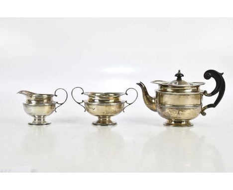BARKER BROTHERS; an Edward VII hallmarked silver three piece tea service, Chester 1909, approximate weight 22.37ozt/ 695.8g.
