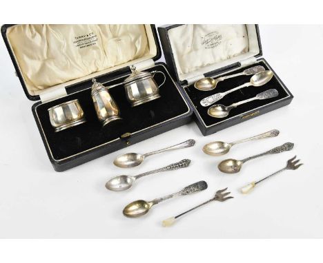ADIE BROTHERS LTD; a George V hallmarked silver three piece cruet, Birmingham 1930, hallmarked silver spoons and a set of fou