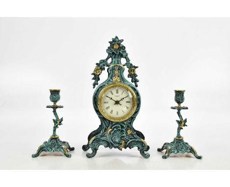 ROBERT GRANT, LONDON; a modern gilt brass and patinated clock garniture, the clock with baskets of flowers finial above the d