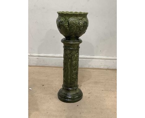 BERMANTOFTS; an art pottery green glazed jardinière on stand, with relief sunflower decoration, height 97cm.Condition Report: