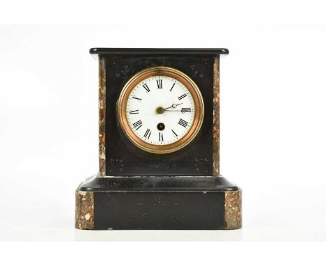 A Victorian slate mantel clock, with white enamel dial set with Roman numerals, height 22cm.