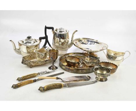 An assortment of silver plate including a Sheffield made four piece tea service, a gallery tray, a Hukin &amp; Heath style bo