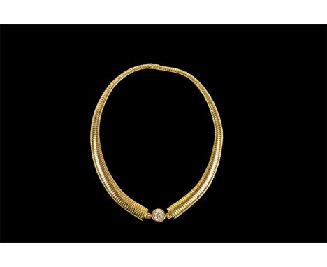 An impressive 18ct yellow gold diamond set flexible ‘tubogas’ necklace, the cushion cut diamond weighing approx 3.4ct, centre