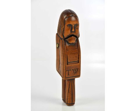 An early 18th century carved nutcracker, initialled 'TW', height 13cm.Condition Report: Age related ware throughout, small sp