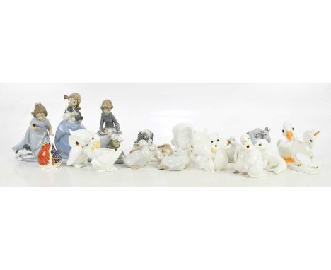 NAO; eight assorted models and figures including a girl clutching a puppy, height 18cm, a girl seated beside rabbit etc, also