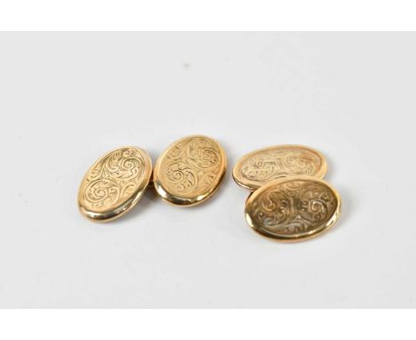 A pair of 9ct gold cufflinks, each with oval engraved platforms, combined approx 3.6g.