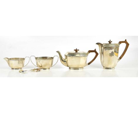 STOWER &amp; WRAGG LTD; a George V hallmarked silver four piece tea service with panel decoration, Sheffield 1920, and a pair