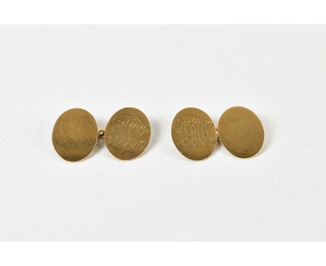 A pair of 9ct yellow gold cufflinks, with engraved initials to each of the oval panels, combined approx 6.4g.