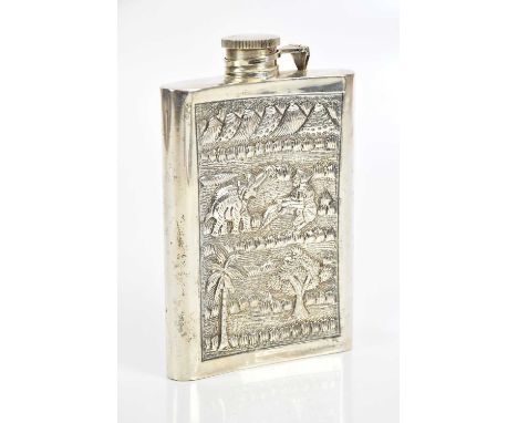 An Indian sterling silver hip flask of curved form, decorated with animals and figure in landscape, and vacant cartouche, hei