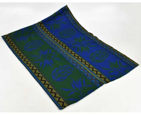 YVES SAINT LAURENT; a 100% lambswool blue and green geometric pattern scarf with fringed edge, 190 x 70cm.