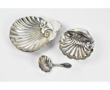 A Victorian hallmarked silver caddy spoon with shell shaped bowl and two hallmarked silver shell shaped butter dishes, combin