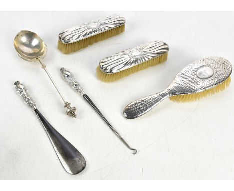 An American sterling silver decorative tablespoon, with ball finial and oval shaped bowl with cast leaf decoration, length 24