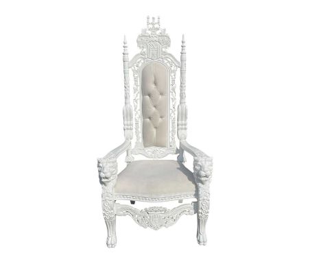A large white painted throne chair, upholstered with a cream seat and back cushion, with lion mask head terminals.